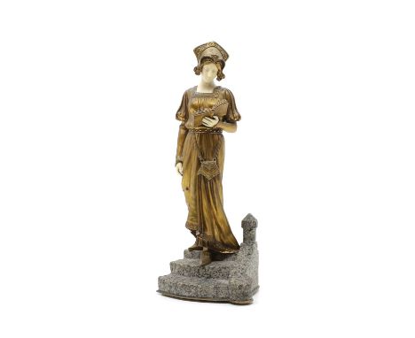 After Dominique Alonzo,  a gilt bronze and ivory figure, depicting a woman reading descending a staircase, signed D.Watring t