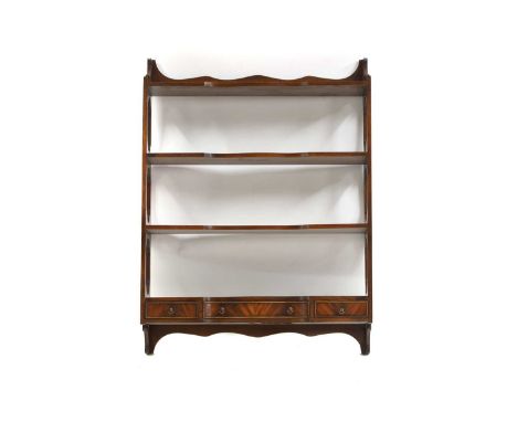 A set of mahogany open shelves 19th century, Chippendale style, the open shelves above three base drawers untied by fretwork 