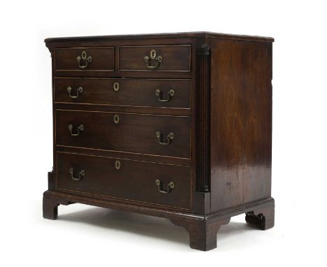 A George III North Country mahogany chest of drawers, 18th century, with quarter-column angles and a arrangement of two short