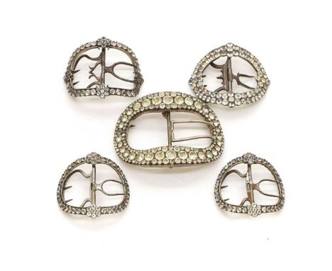 A collection of shoe buckles late 18th to early 19th century, comprising a pair and three single examples, with cut paste sto