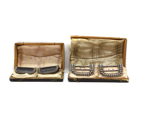 Two cased pairs of silver shoe buckles comprising;a pair by William Eley,London 1791, stamped 'Eleys Patent 20390', with brig