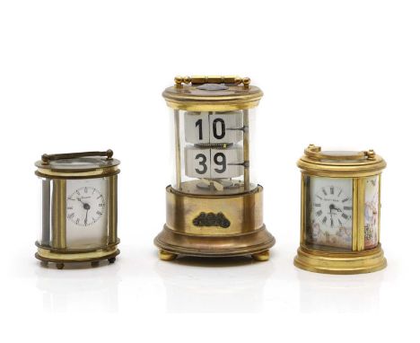 An Ever-Ready Chronos ticket flip clock, 20th Century, in a brass case 10cm diameter15cm high together with two oval form car