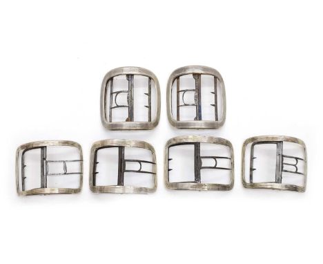 Three pairs of George III silver shoe buckles comprising;a pair by William Simmons,c.1784, of rectangular form, with reeded d