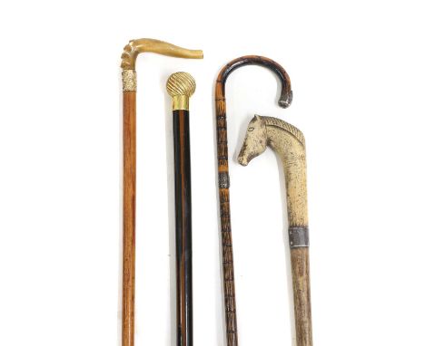 Two gilt mounted walking sticks, c.1900, on mounted with a horn handle, 93.5cm long;a silver mounted walking cane, 90cm longa