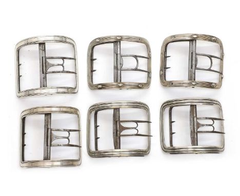 Three pairs of George III silver shoe buckles comprising;a pair by George Baskerville.London 1793, with reeded decoration, 7c