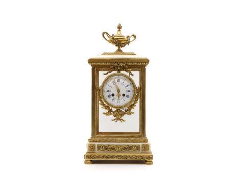 An ormolu and white marble four glass mantel clock, 19th century, French, the white enamel dial with painted floral swags and