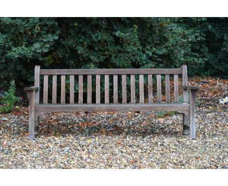 A teak garden bench 20th century, remnants of label, 192cm wide, 68cm deep, 85cm high, seat 39cmCondition ReportWeathered. No