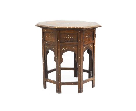 A Hoshiarpur octagonal hardwood and ivory inlaid table,  with folding frame,  51.5cm diameter 51.5cm high  IMPORTANT NOTEThis