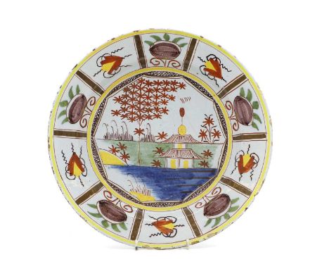 A polychrome painted Delftware plate early 18th century, painted with a chinoiserie scene, 36cm diameterCondition ReportFritt