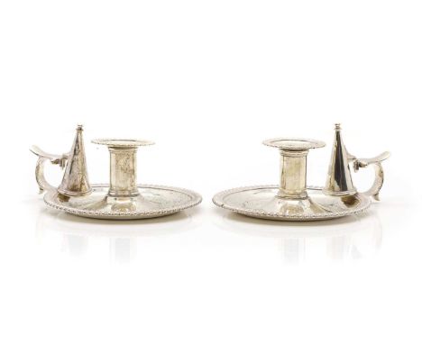 A pair of Victorian silver chambersticks, by Robert Hennell III, London 1844, of traditional circular form with gadrooned rim