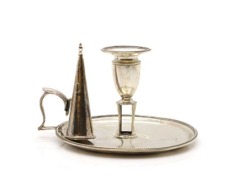 A George III silver chamber candlestick, London, 1783, with an unmarked snuffer14.5cm diameter10cm high8.6ozt (2)