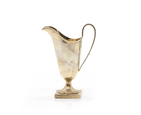 A George III style silver cream jug, Viner's Ltd., Sheffield 1935, of helmet shape with a square base, 5cm wide10cm deep14cm 