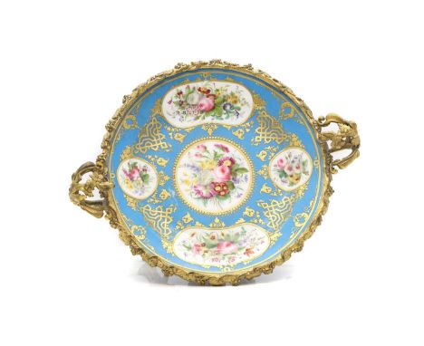 A Sèvres shallow foliate decorated dish, late 19th century,the blue celeste ground with figural reserve panels embellished wi