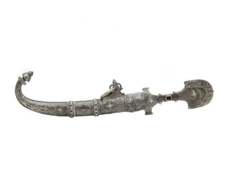 A Moroccan white metal dagger,  20th century, with red glass applied to the hilt, the scabbard and hilt with chased decoratio