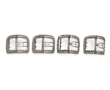 Two pairs of George III silver shoe buckles comprising;a pair by Benjamin Mountigue,c.1785, with bright-cut decoration,7.5cm 