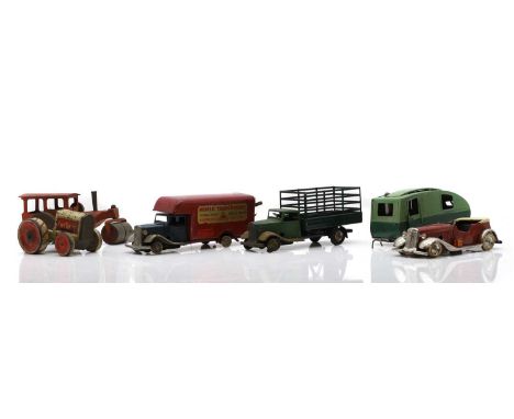 A collection of Tri-Ang Minic toy vehicles, comprising a green caravan, a 'Road, Rail, Air and Sea' delivery van, a pickup tr