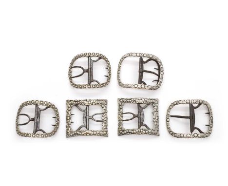 Three pairs of George III silver shoe buckles comprising;a pair by Stephen Adams,c.1765, of oval form, 5.6cm widetogether wit