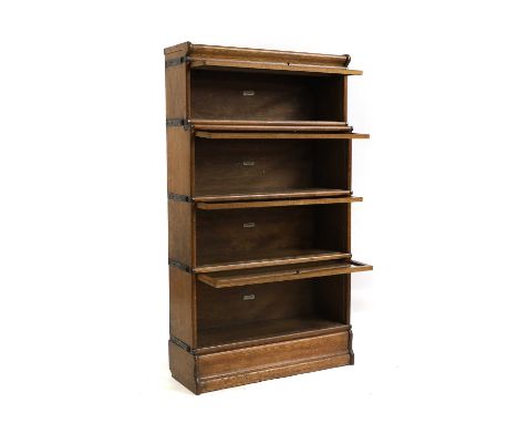 A Globe Wernicke oak section bookcase Four section, fitted separate cornice and plinth,86cm wide28.5cm deep154cm highConditio