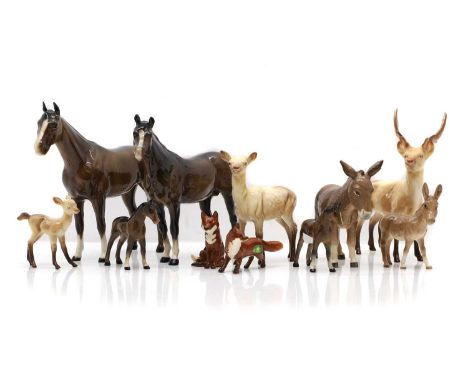 A collection of Beswick model animals, to include, a stag, a doe, a fawn, two foxes, a donkey, a foal, and four horses the la