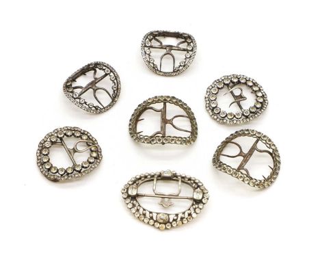 A collection of shoe buckles late 18th to early 19th century, comprising three pairs and one single example, of oval form, in