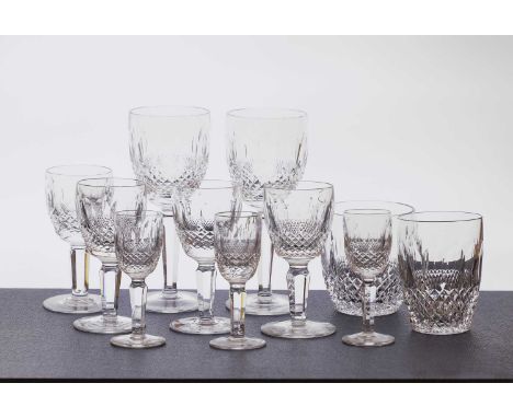 A Waterford Colleen pattern crystal glass suite, comprising a decanter, 32cm high, six champagne glasses, 19cm high, two coup