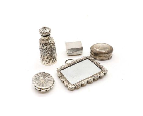 A collection of silver dressing table items comprising a Victorian oval form box, London 1895, with embossed decoration of pu