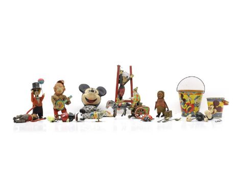 A collection of clockwork toys to include a Schuco Patent clockwork monkey holding a suitcase, 11.5cm high, a monkey wearing 