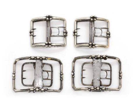 Two pairs of George III silver shoe buckles comprising a pair by William Eley,London 1797, with bright-cut decoration to a be