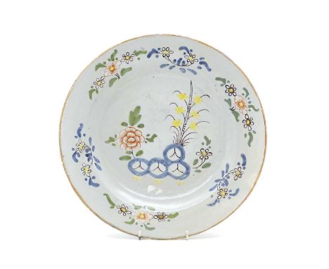 A polychrome painted Delftware dish early 18th century, painted with floral sprays, 35.5cm diameterCondition ReportFritting a