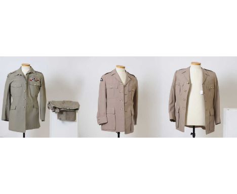 A collection of British Army service uniforms worn by a former Colonel in the Royal Engineers,  all in light khaki, two jacke
