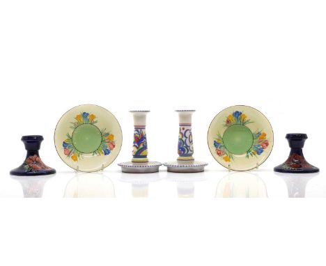 A pair of Moorcroft 'Poppy' dwarf candlesticks, 8.5cm high;together with a pair of Poole candlesticks, 14cm high;a pair of Cl