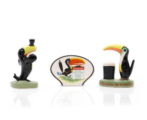 Three Guinness Toucan ceramic pieces,  to include, two Carltonware figures, one depicting a toucan balancing a Guinness on it