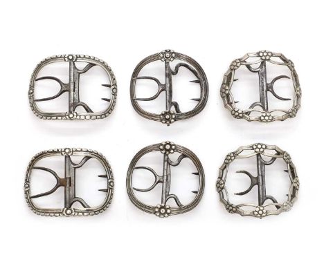 Three pairs of George III silver shoe buckles comprising;a pair by Thomas Farren,London c.1740, of oval form with floral moti