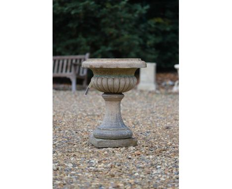 A terracotta low garden urn, 20th century, on a low socle plinth, 40cm diameter 56cm highCondition ReportTwo parts. Chips to 