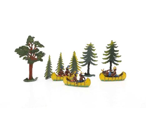 A collection of Britain and Taylor and Barrett die cast toys, including six Native Americans in three canoes, trees and other