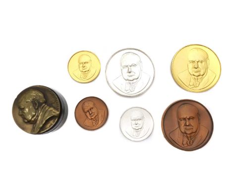 A collection of commemorative medallions comprising a 1964 Sir Winston Churchill silver commemorative Medallion, a silver gil