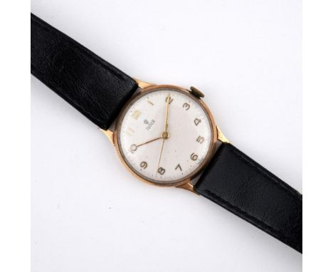 A GENTLEMAN'S GOLD WRISTWATCH BY TUDOR. the signed circular dial with Arabic numerals, with Rolex logo to the winder, present