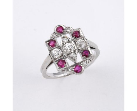 A RUBY AND DIAMOND CLUSTER RING. the openwork mount is set with circular-cut rubies and old-cut diamonds in 18ct white gold a