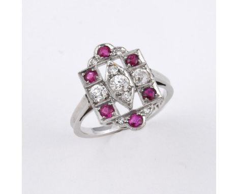 A RUBY AND DIAMOND CLUSTER RING. the openwork mount is set with circular-cut rubies and old-cut diamonds in 18ct white gold a