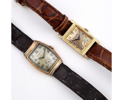 A GOLD PLATED WRISTWATCH BY BULOVA. the tonneau-shaped dial with Arabic numerals, numbered to the reverse 4510186, 25mm wide,