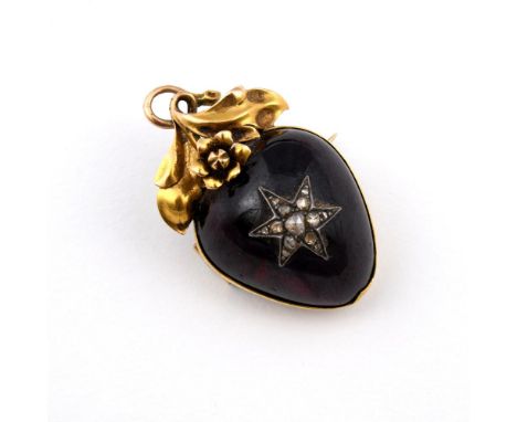 A VICTORIAN GARNET AND DIAMOND BROOCH PENDANT. the pear-shaped cabochon garnet mounted with a star motif set with rose-cut di