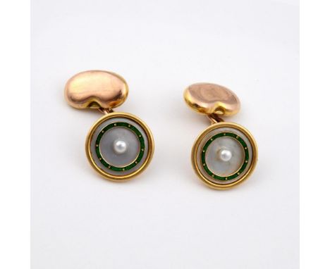 A PAIR OF MOTHER OF PEARL AND ENAMEL CUFFLINKS. each mother of pearl link centred with a small pearl, with green enamel decor