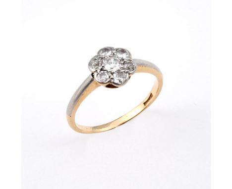 A DIAMOND CLUSTER RING. mounted with circular old-cut diamonds, in 18ct gold. Size N.  **BP 22.5% inc VAT + Lot Fee of £8  