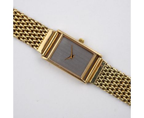 A LADY'S 14CT GOLD WRISTWATCH BY MILUS. with signed rectangular-shaped dial, on a 14ct gold mesh bracelet with deployant clas
