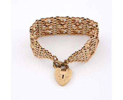 A 9CT GOLD WIDE FANCY LINK BRACELET. with foliate engraved padlock clasp, 17cm long, 30.7 grams.  **BP 22.5% inc VAT + Lot Fe