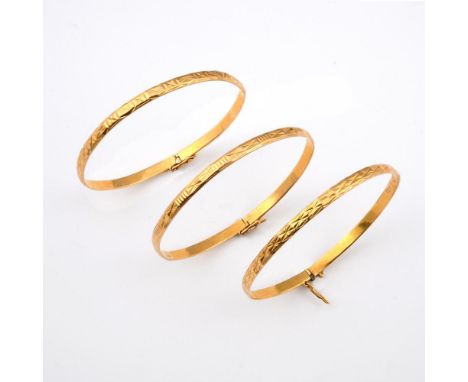 THREE GOLD BANGLES. each with engraved decoration, total weight 25.8 grams.  **BP 22.5% inc VAT + Lot Fee of £8  