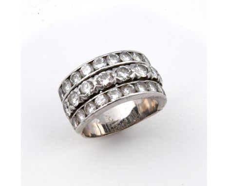 A DIAMOND THREE ROW RING. mounted with circular-cut diamonds, with expanding shank. Size K.  **BP 22.5% inc VAT + Lot Fee of 