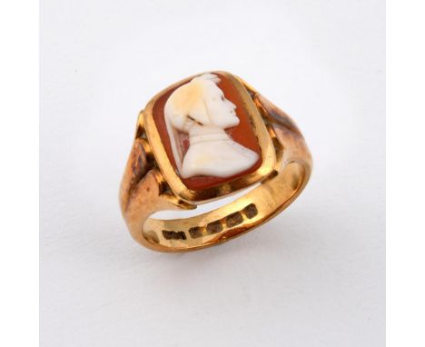 A CARVED SHELL CAMEO &amp; GOLD RING. depicting the profile of a classical figure, in an 18ct gold mount. Size N 1/2.  **BP 2