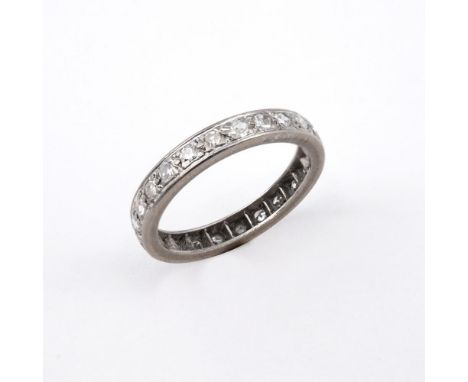 A DIAMOND FULL CIRCLE ETERNITY RING. millegrain set with circular-cut diamonds. Size O 1/2.  **BP 22.5% inc VAT + Lot Fee of 