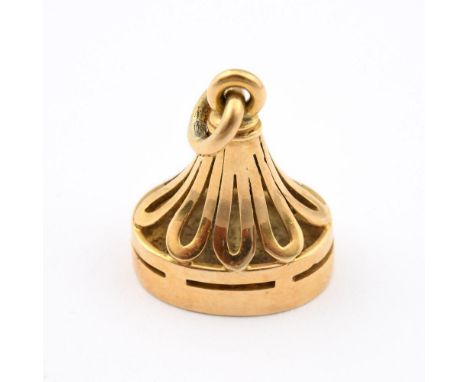 AN 18CT GOLD SEAL. fluted body, the gold matrix engraved with a coat of arms, 2.5cm high, 14.3 grams.  **BP 22.5% inc VAT + L